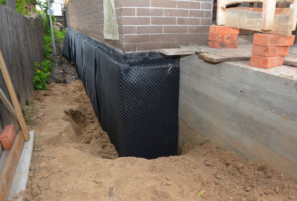 Happy homeowners after waterproofing job in Edmore